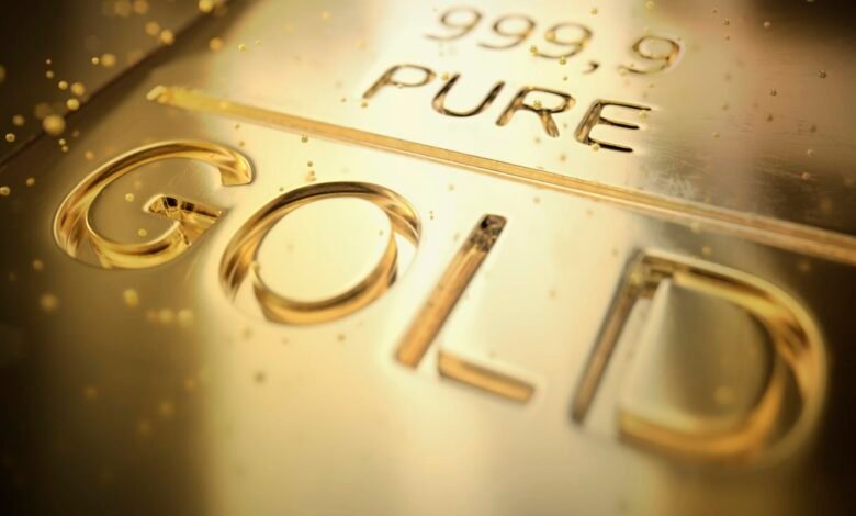 Gold ticks up on dollar retreat, Fed rate cut