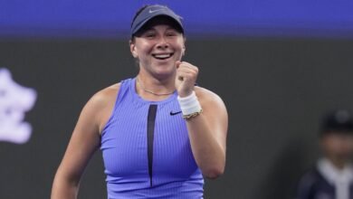Amanda Anisimova, of the United States reacts after defeating Jasmine Paolini, of Italy in the women