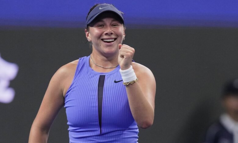 Amanda Anisimova, of the United States reacts after defeating Jasmine Paolini, of Italy in the women