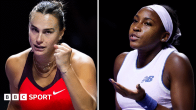 Aryna Sabalenka clenches her fist in celebration at the WTA Finals, while Coco Gauff gestures to her team